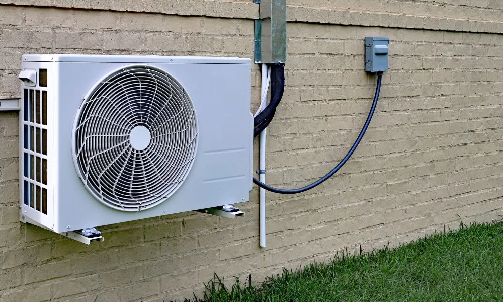 Best DIY mini split reviews 2025 — pre-charged ductless mini split condenser and line set installed on a home's exterior wall